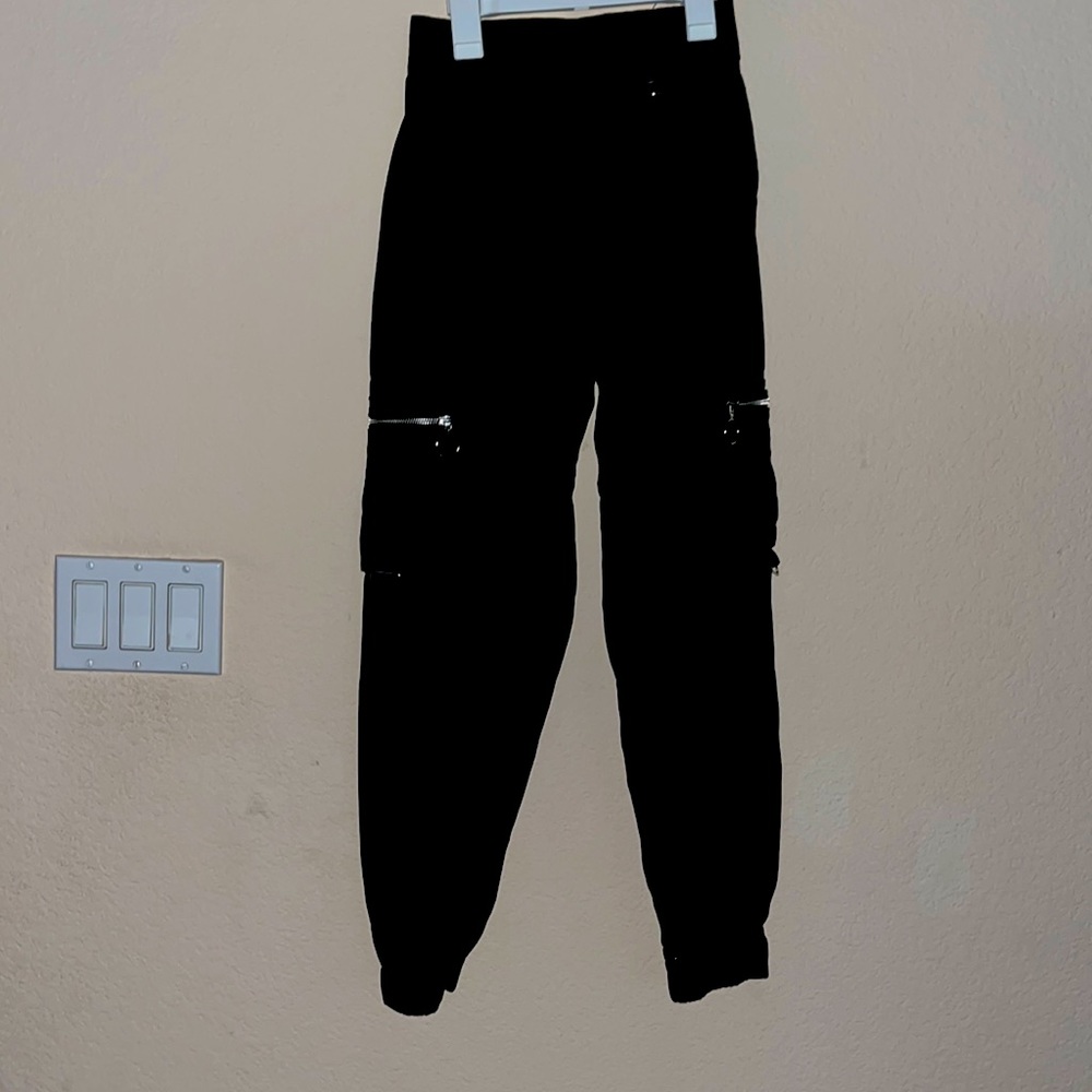 Black puffy jeans with silver zippers